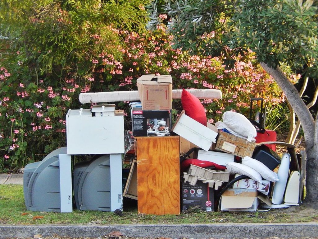 AJ's Junk Removal LLC team clearing clutter from a residential property in Bethel, CT